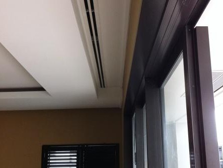 Ducted air conditioning concealed in the ceiling of a Viaduct apartment